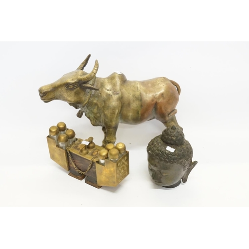 1002 - An Indian made Brass study of a Bullock, a head of Buddah & an Indian Perfume Box.