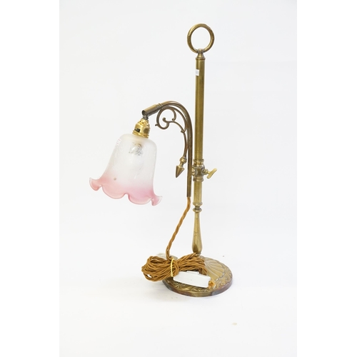 981 - A Victorian design Brass Desk Lamp with a Cranberry Glass Shade & Carrying Handle.