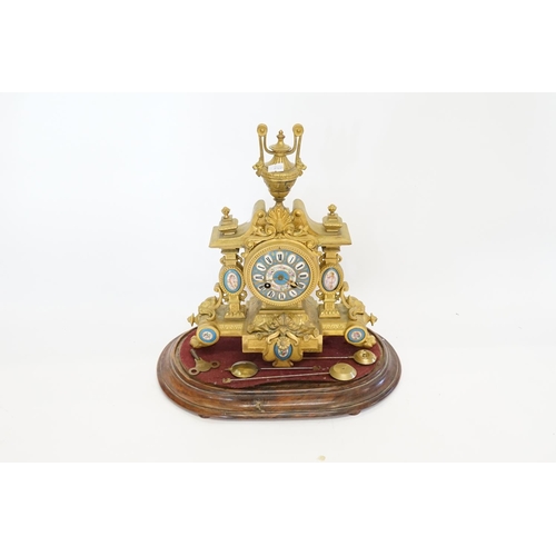 224 - A French Spelter Drawing Room Clock mounted with Sevres Blue panels on a Wooden Stand along with thr... 