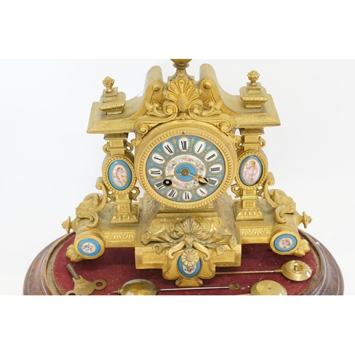 224 - A French Spelter Drawing Room Clock mounted with Sevres Blue panels on a Wooden Stand along with thr... 