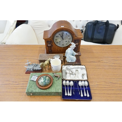 225 - An Oak Cased Bracket Clock with a Nickel Silver Dial, a Porcelain Figure, Cutlery, etc.