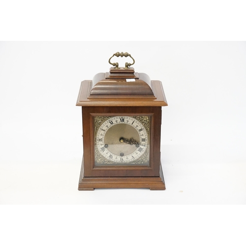 226 - A Georgian design Bracket Clock contained in a Mahogany Case, Visible glass side panels & the moveme... 