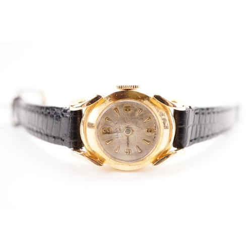 186 - A ladies 18ct gold cased DOXA cocktail watch, with leather strap. Original guarantee from 1957.