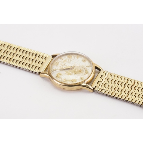 192 - A 9ct gold Zenith Watch in a Denison case, with a gold plated strap.