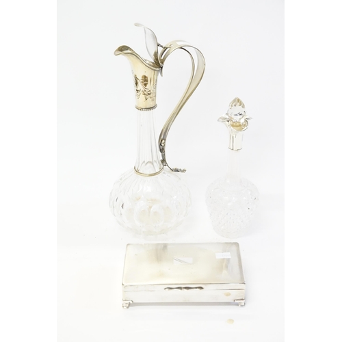 73 - A Cut Glass & Silver mounted Liquor Bottle, a Claret Decanter with Silver Plated mount & a Silver Pl... 