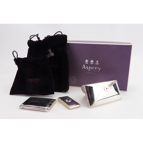 2 - A Silver “Asprey of London” business card holder set in the envelope style. Hallmarked 2006. Contain... 