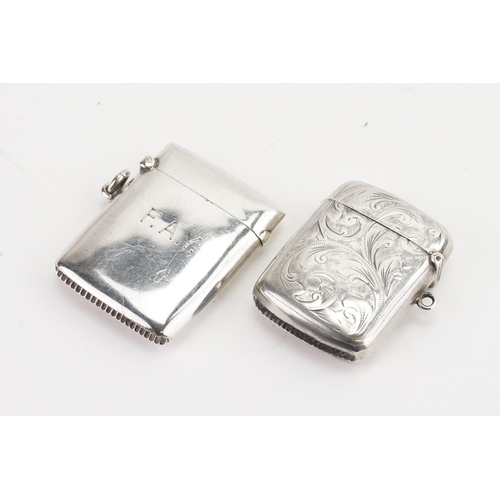 10 - A silver engraved vesta case along with one other. Weight: 50 Grams.