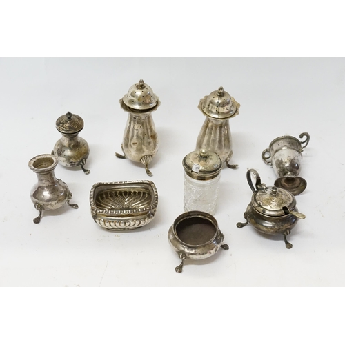 21 - A collection of Silver items to include Silver Cruet Sets, Salts, Trophy Cups, etc.