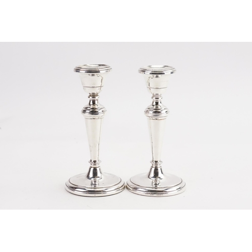 19 - A Pair of Silver Candlesticks.