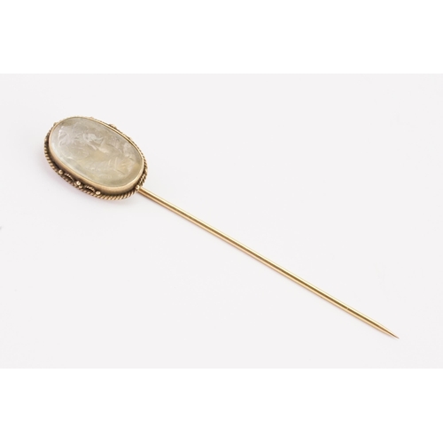 97 - A carved moonstone cameo stick pin. depicting a young lady looking to her left.