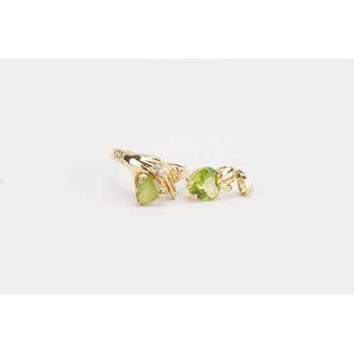 112 - A 18ct gold peridot and diamond set ring, set with a love heart peridot, along with a matching penda... 