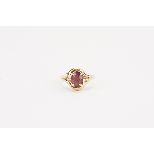 114 - A 14ct gold oval garnet set ring. Weight 3.7g. Size N.