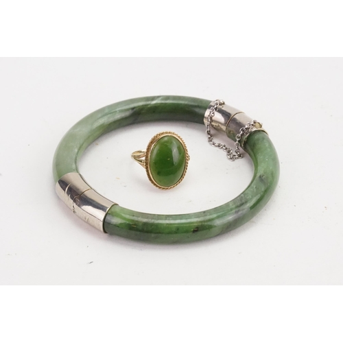 116 - A Nephrite silver coloured mounted bangle, along with a 9ct gold nephrite ring.