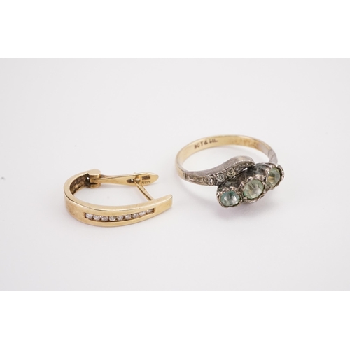 131 - A 9ct gold and silver set ring, along with a single 18ct earring.