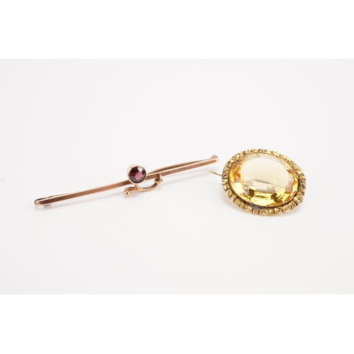 136 - A citrine brooch, along with a 9ct gold garnet set brooch. Weight 5.3g.