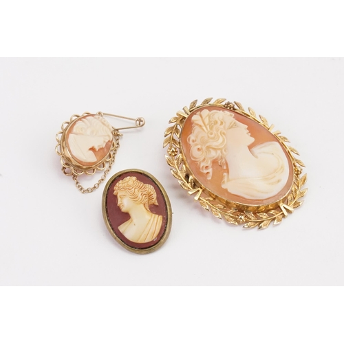 137 - A 9ct gold floral border cameo brooch, along with another 9ct and one other. (weight of 9ct 17.6g.in... 