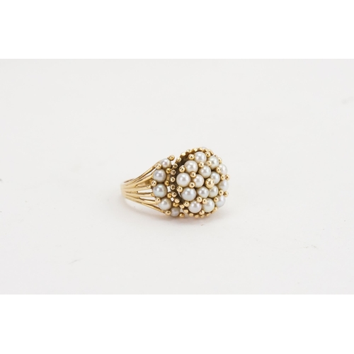 141 - A Foreign marked Gold Coloured Dress Ring set with Seed Pearls. Weight: 9.3 grams.