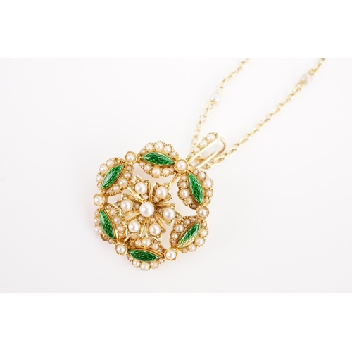 143 - A 15ct gold seed pearl and green enamelled flower pendant and brooch. Weight 7g. Hung on a seed pear... 