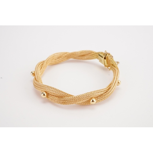 146 - A 18ct gold tube and ball design bracelet, hung with safety chain. Weight 17.3g.