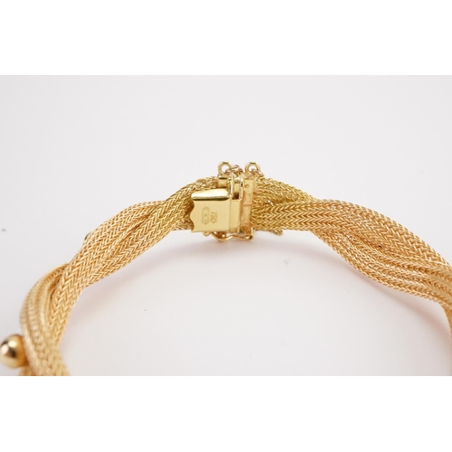 146 - A 18ct gold tube and ball design bracelet, hung with safety chain. Weight 17.3g.