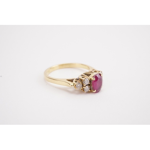 152 - A 18ct gold ruby and diamond set ring. Weight 3.4g. Size L.