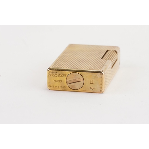 295 - A gold plated Dunlop lighter marked Paris 8509bh.