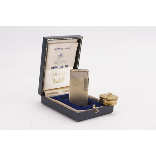 298 - A silver plated Dunhill lighter, contained in original box, along with a small pot.