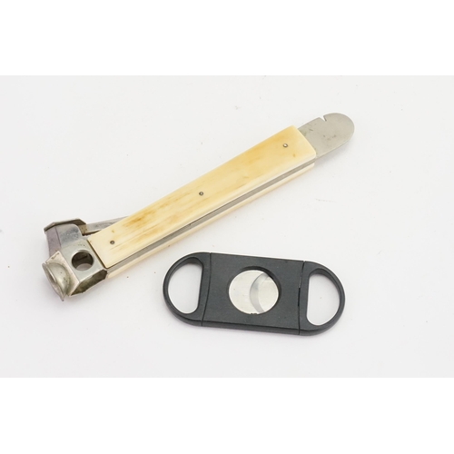 300 - A Bone Handled Cigar Cutter & a Double Action Cigar Peircer.