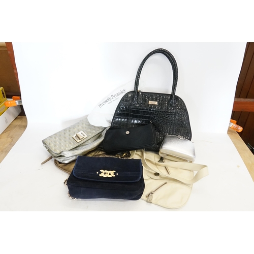 390 - A collection of ladies handbags to include Stuart Weitzman, Osprey, Russell & Bromley, Suzy Smith et... 