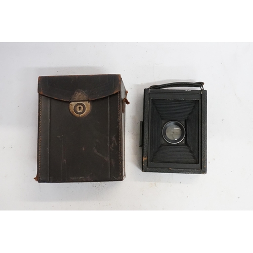 973 - A Zeiss Ikon Quarter Plate, adjustable Lens Back Opening Camera with Three Plates contained in a Lea... 