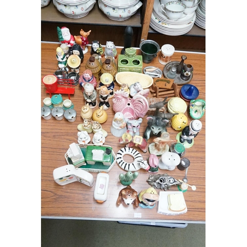 937 - A collection of cruet sets to include, beehive, pigs, fridges etc.