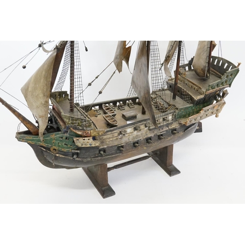 1030 - A Scratch Built Study of a Man o War Boat on Stand. Measuring: 51cms long x 57cms high. (AF).