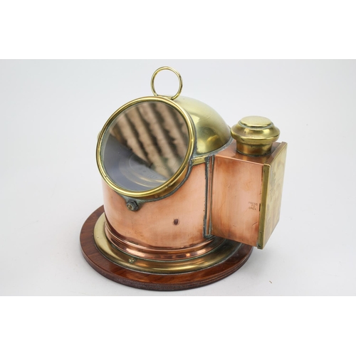 1037 - A Brass and Copper mounted binnacle Compass on a wooden stand.