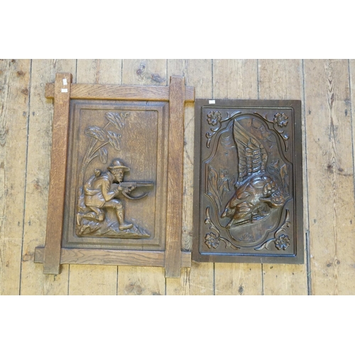 964 - A Late 19th Century Carved Oak Panel of a Huntsman along with one other of a Bird of Paradise.