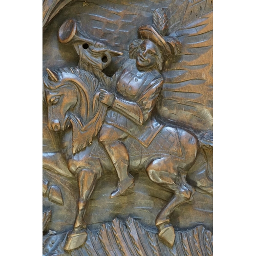 966 - A Late 19th Century Carved Chestnut Panel depicting a Trumpeter on a Horse.