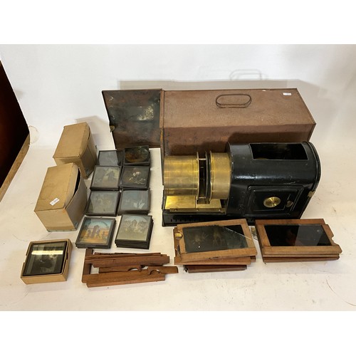 940 - A Victorian Magic Lantern with Brass Fittings in Original Metal Carrying Case along with a collectio... 