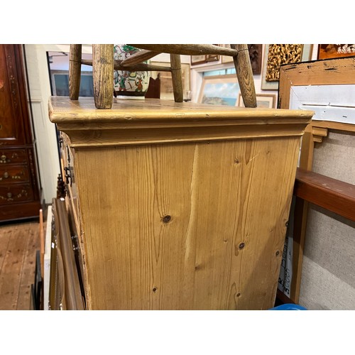 585 - A Pine Tallboy Chest fitted with graduated drawers, Brass Handles & resting on Bracket Feet. Measuri... 