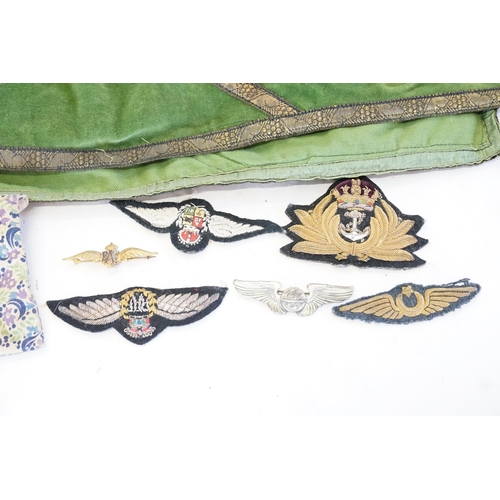 669 - A Collection of Badges to include RAF, Naval, etc, along with a Needlework Table Cover.