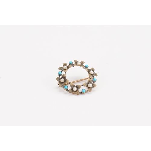 143 - A 15ct gold turquoise and seed pearl brooch, in a wreath design. Weight 2.5g.