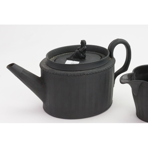 813 - A Wedgwood Adam's design Black Basalt Tea Pot, Sugar Bowl & cover & Cream decorated with female fini... 