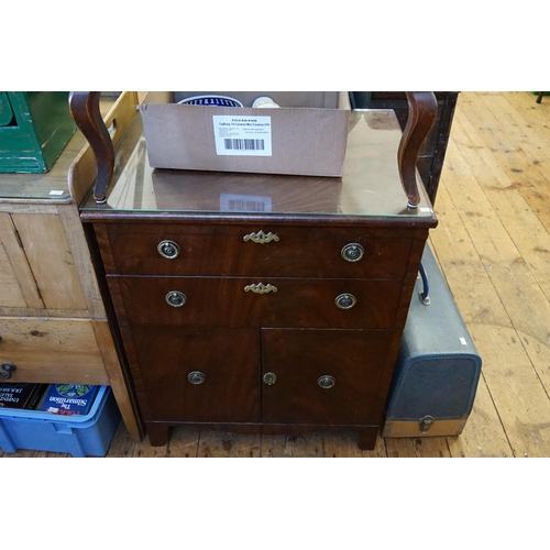 510 - A Mahogany Cupboard fitted with Drawers & resting on Bracket Feet with a Glass Top. Measuring: 61cms... 