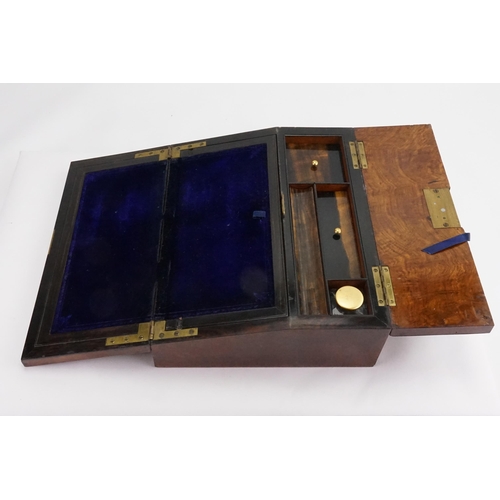 735 - A Victorian Walnut & Brass mounted Fold over Top Writing Slope with fitted interior & Key.