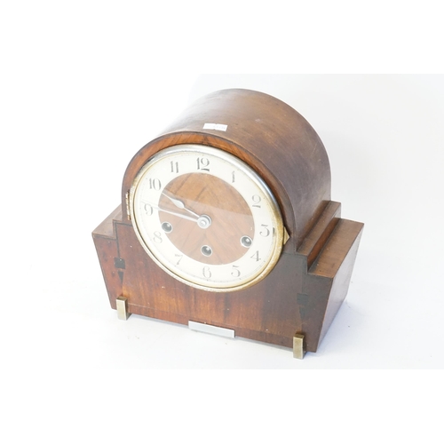 231 - A Walnut cased Bracket Clock with Westminster & Chime in an Art Deco Case.