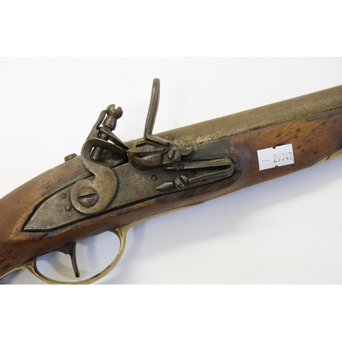 672 - An 18th Century Flintlock Pistol with Brass mounts & Ram Rod.