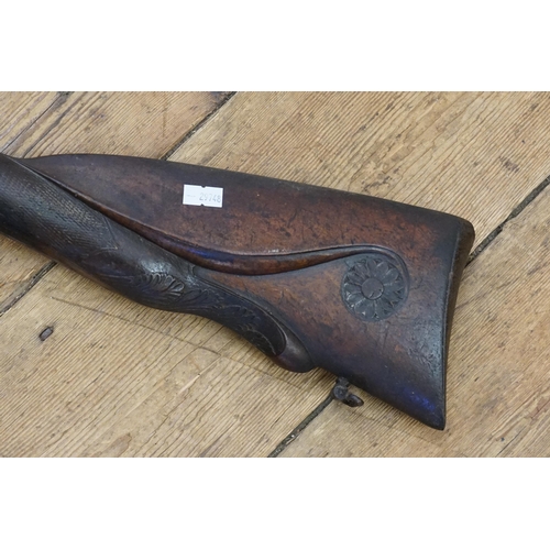 673 - A late 18th Century Double Barrelled Percussion Capped Shot Gun with heavily carved stock, signed by... 