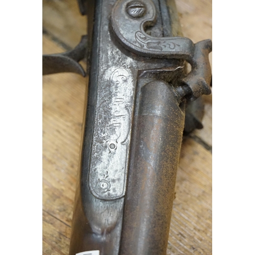 673 - A late 18th Century Double Barrelled Percussion Capped Shot Gun with heavily carved stock, signed by... 