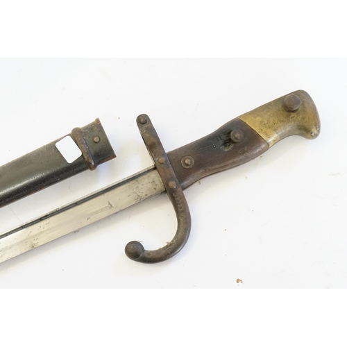 674 - A WWI Bayonet with Scabbard Brass mounted No: 86690.