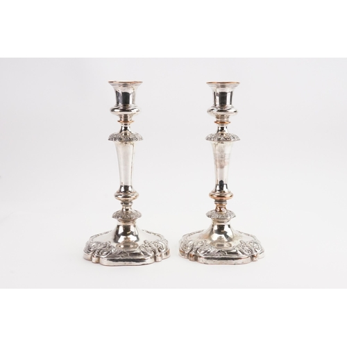 131 - A Pair of Silver Plate on Copper Candlesticks. Measuring: 25cms.