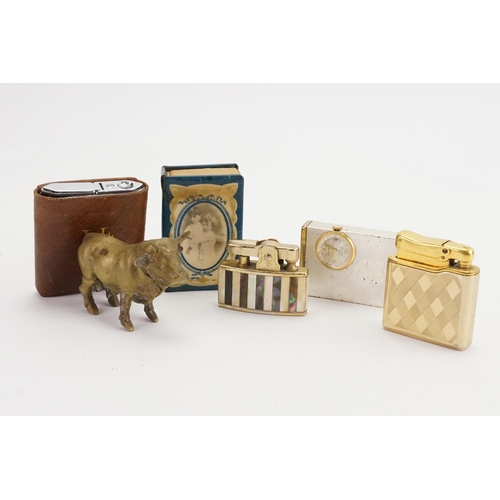 732 - A Vesta Case designed as a Bull, Four Cigarette Lighters & a Box of Matches.