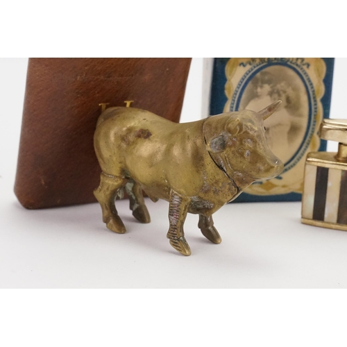 732 - A Vesta Case designed as a Bull, Four Cigarette Lighters & a Box of Matches.